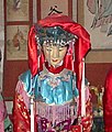 Restoration of a blue Yunjian embellished with fringes as part of the traditional Chinese wedding of the 19th century, Folk Customs Museum, Luoyang, China