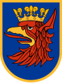 The arms of Szczecin are exempt from the rule of tincture because the crowned griffin's head is of a colour and metal.