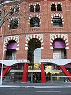 Facade of the former bullfighting ring Plaza de toros de las Arenas, Barcelona, Spain. Built in 1900, by 1977 it had fallen into total disuse. It was reopened in 2011 as a shopping centre named Arenas de Barcelona, on a project by Richard Rogers.