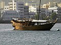Muscat Harbor - A traditional Omani Dhow lies anchored in the Muscat Harbor (World's largest natural harbor)