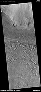 Part of lobate debris apron, as seen by HiRISE under HiWish program This lobate debris apron surrounds a mesa. Location is the Ismenius Lacus quadrangle.