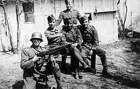 Hungarian soldiers in the Carpathians in 1944 (one wearing a helmet and the rest wearing forage caps)
