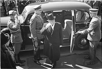 Kallio stepping out of his car; Marshal Mannerheim stands left from him.