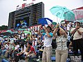 Swallows fans supporting hold an umbrella in 2006