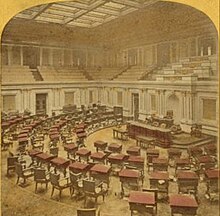 One panel of a stereographic view of the Senate in the 19th century; hand-colored image shows desks, dais, and gallery above