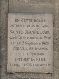 A plaque commemorates the visit of Joan of Arc to the church in 1429