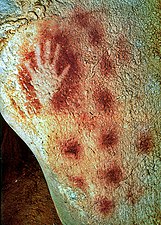 Prehistoric negative hand print in red ochre from Pech Merle Cave in Le Lot, France
