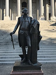 The plaque beneath Washington's statue reads, "During the occupation of Columbia by Sherman's Army February 17–19, 1865, soldiers brickbatted this statue and broke off the lower part of the walking cane."
