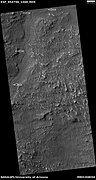 Channel, as seen by HiRISE under HiWish program. Arrows indicate position of channel in this rather dark photo.