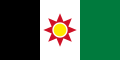 The flag of Iraq from 1959–1963, it espouses a unified Iraqi identity bearing pan-Arab colours (black, green, red, white), Kurdish colours (green, red, white, yellow), the ancient Assyro-Babylonian Star of Ishtar symbol in red behind the Kurdish yellow sun.