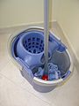 A mop bucket with a wringer
