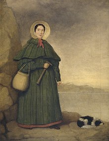 Portrait of a woman in bonnet and long dress holding rock hammer, pointing at fossil next to a spaniel lying on ground.