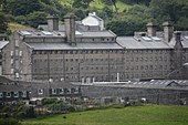 Large, six-floor prison building, built from Dartmoor granite.