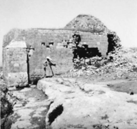 A black-and-white photograph of partly ruined, domed mausoleum building in the town of Jenin in northern Palestine in 1941