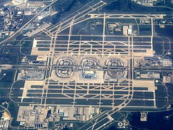 An aerial photograph of DFW Airport, including its runways.