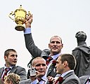 Lawrence Dallaglio holding the Rugby World Cup.