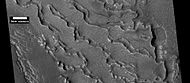 Small and large cracks, as seen by HiRISE under HiWish program The small cracks to the left will enlarge to become much larger dues to sublimation of ground ice. A crack exposes more surface area, hence greatly increases sublimation in the thin Martian air.