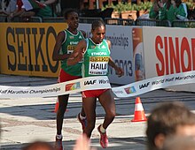 woman crossing the finish line