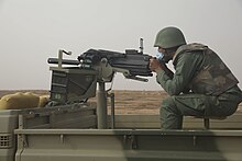 Moroccan soldier using the Mk19 grenade launcher