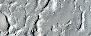 Close, color view of hollows on crater floor, as seen by HiRISE under HiWish program many cracks are visible. Ground rich in ice often forms cracks. When a crack appears, there is enhanced loss of ice from the ground. Eventually, a small crack may evolve into a hollow.