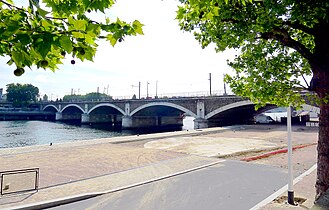 The first railroad bridge across the Seine (1852–53), originally called the Pont Napoleon III, now called simply the Pont National.