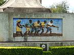 A mural depicting farmers working with hoes
