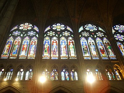 The glazed triforium (center level) and upper clerestory, where windows fill almost the entire wall, a prominent feature of Rayonnant Gothic. (present windows from 19th c.)