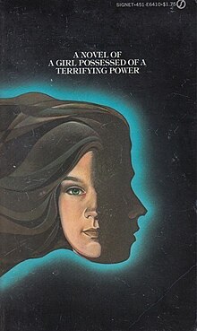 The cover art for the 1975 paperback edition. A teenage girl's face is partially obscured and facing forward. Behind her is a silhouette facing to the right, bordered with a blue light. Above the face is a tagline that says "A novel of a girl possessed of a terrifying power".