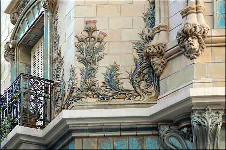 Thistles and curve-lined mascarons in decoration of Les Chardons building in Paris by Charles Klein (1903)