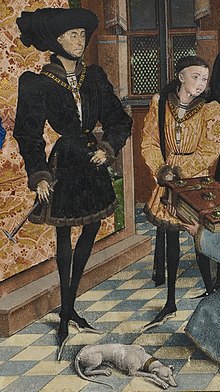 Philip the Good, dressed in black, wearing chaperon, and beside him is Charles, bareheaded and wearing the collar of the Order of the Golden Fleece