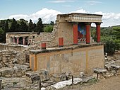 The restored North Entrance of the Knossos Palace Complex with a charging bull fresco