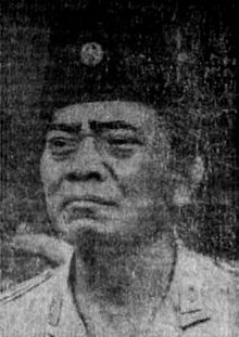 A black-and-white portrait of an Indonesian Army general in an army uniform and songkok facing towards the viewer's left.