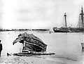 Wrecked ships in Apia Harbour. German gunboat SMS Eber is on the beach, the stern of USS Trenton is at the right, and the sunken USS Vandalia is alongside. SMS Adler is on her side in the center distance.