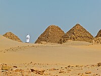 A man walks among the pyramids