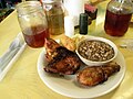 Twice cooked chicken, potato salad, purple hull peas, corn bread, and iced tea