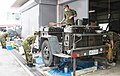 Japan Ground Self-Defense Force soldiers preparing meals on a yagai suigu trailer kitchen