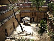 A dugout dwelling enclosing an underground courtyard.