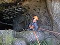 Child rappelling in an underground vault with columbarium (dovecote) at Park