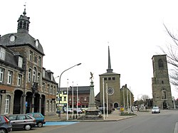 Saint-Ghislain: the former town hall (1752), the new church, and the tower of the old church (16th century)