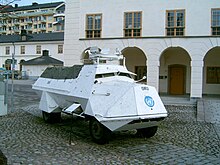 Large, white four-wheeled vehicle with the UN logo on the front