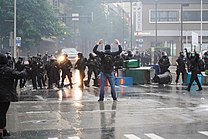 Police and protesters stand off in Seattle on May 30