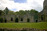 The cloister court, including the sacristy and chapter house, viewed from the north, over the remains of the lay brothers' range.