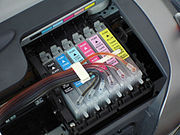 Retrofit ink tubes connected to a standard printer cartridge
