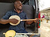 Niger and northern Nigeria. Hausa musician playing a Garaya