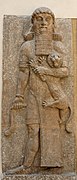 Relief from a façade in the throne room of Sargon II (Khorsabad, 713–706 BC), showing an Assyrian hero grasping a lion and a snake, Louvre