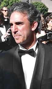 A photograph of Jay Thomas in a tuxedo and looking away from the camera.