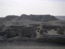 A maze of low walls and ruins in the desert