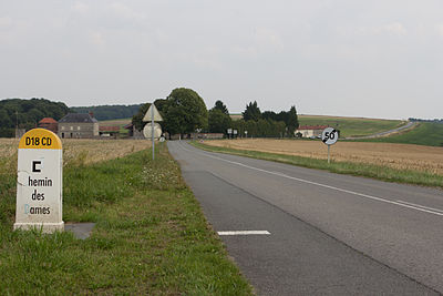 Photograph shows Route D18 CD on the Chemin des Dames with Heurtebise Farm at left.