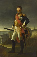 Painting of a standing man with a bicorne hat in his left hand and his right hand holding a marshal's baton. He wears a dark blue military coat with much gold braid, white breeches, black knee boots and a red sash across his chest. His face has a cleft chin and a stern look under dark hair.
