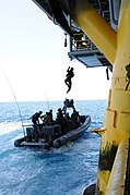 U.S. Navy SEALs train with Special Boat Team 12 on the proper techniques of how to board gas and oil platforms from a moving vessel near Long Beach, Calif., on July 28, 2011.